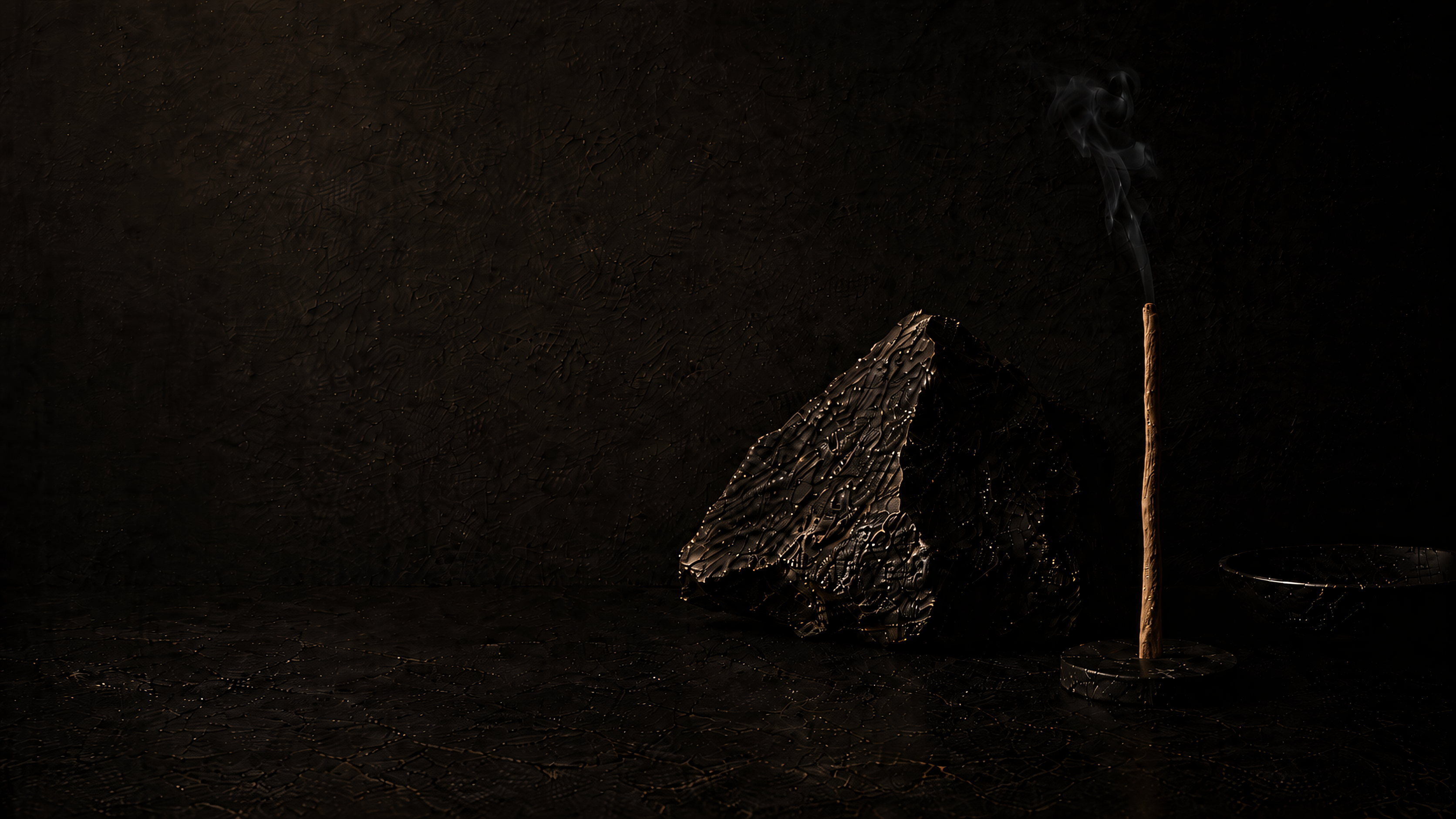 Hand pressed incense burning in a stone holder
